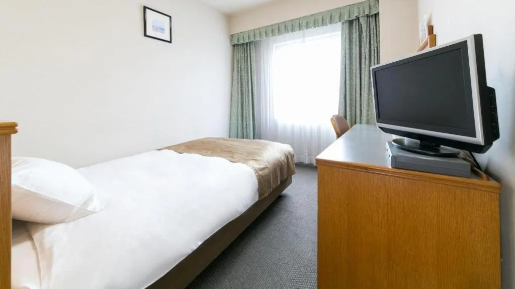 Bed in Pearl Hotel Ota