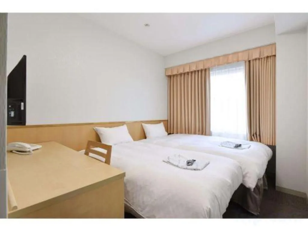 Bed in Pearl Hotel Ota