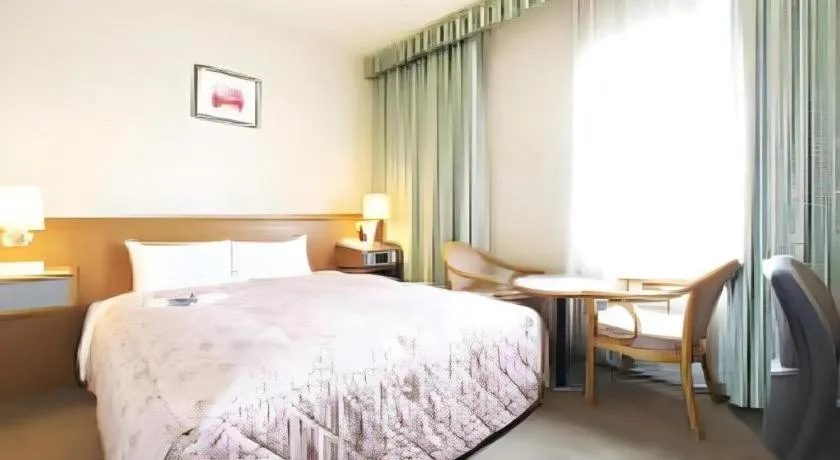 Bed in Pearl Hotel Ota