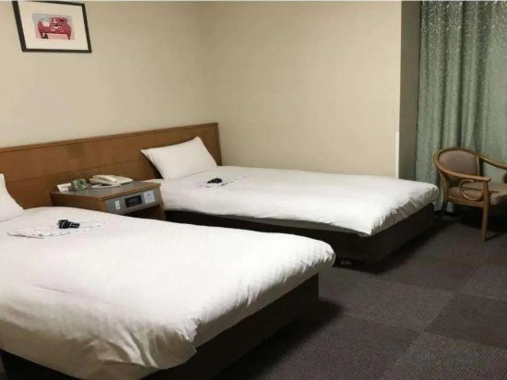 Bed in Pearl Hotel Ota