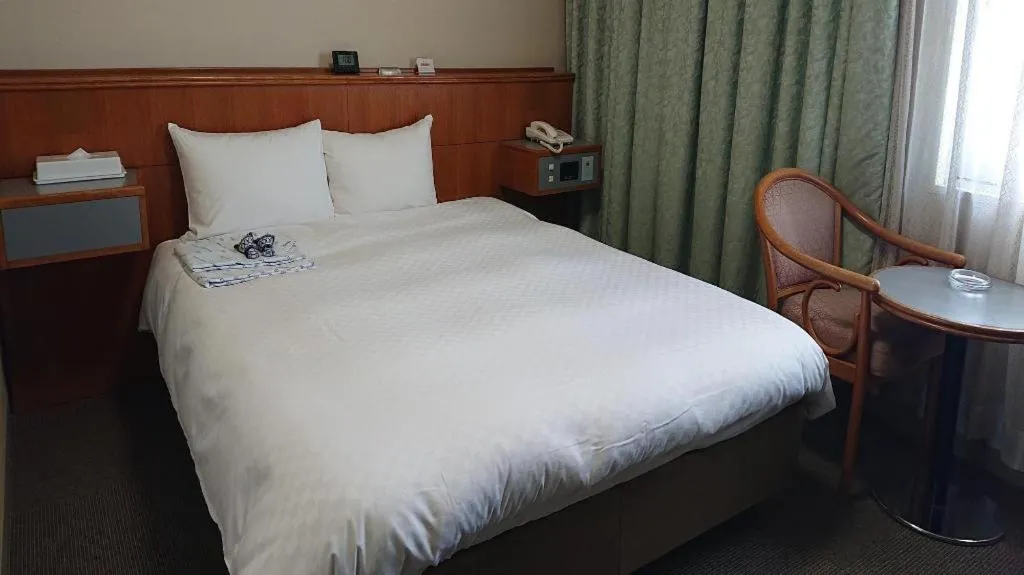 Bed in Pearl Hotel Ota