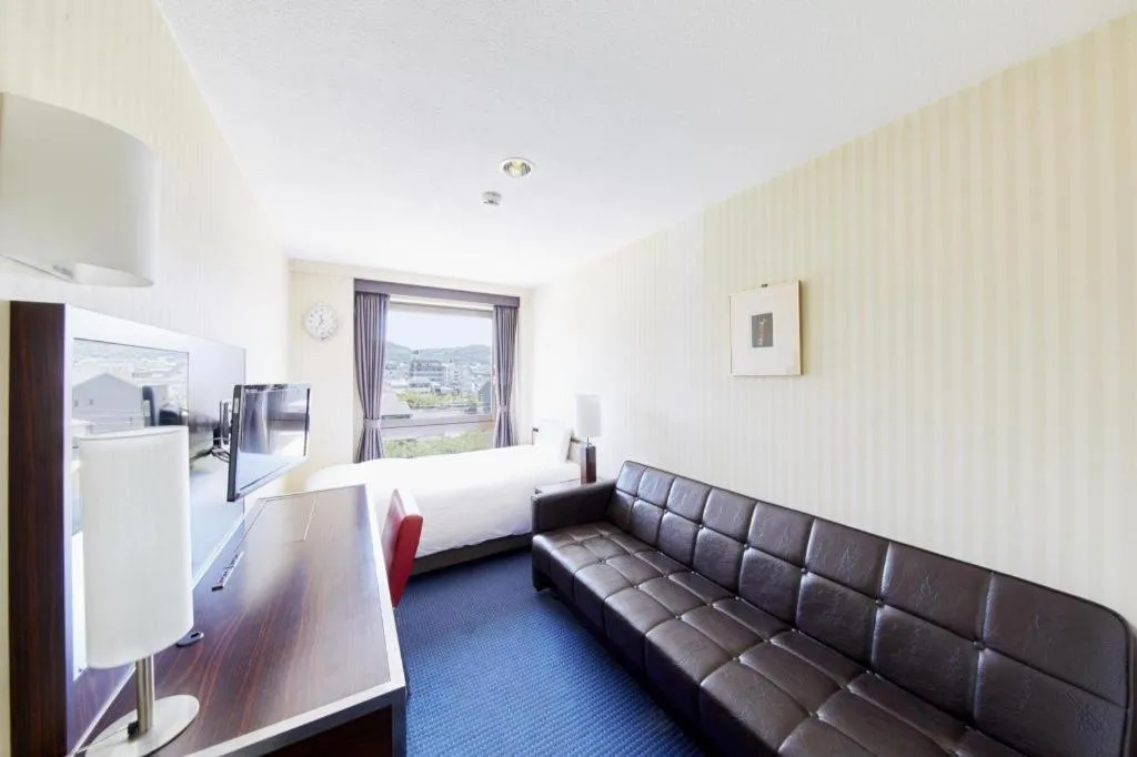 Bed in Hotel Sunroute Kyoto