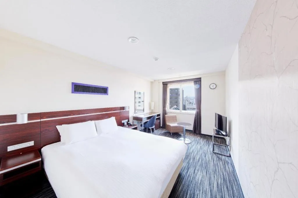 Bed in Hotel Sunroute Kyoto