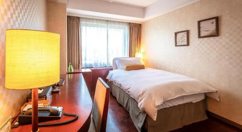 Bed in Miyazaki Kanko Hotel