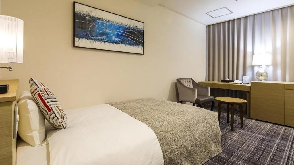 Bed in Miyazaki Kanko Hotel