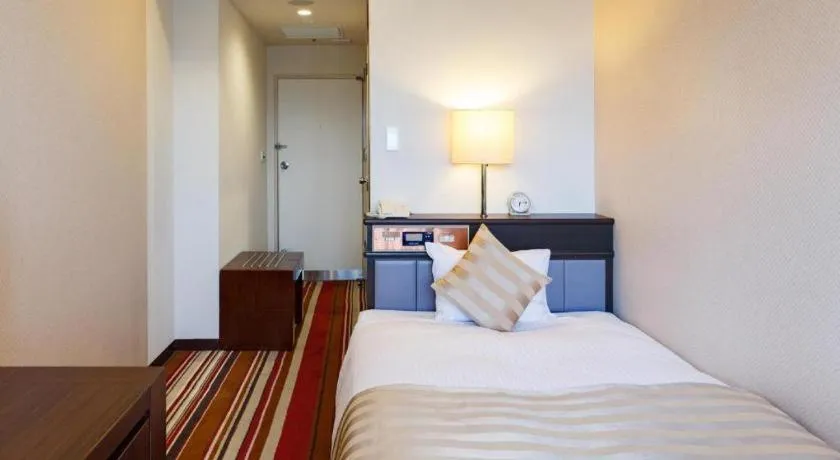 Bed in Miyazaki Kanko Hotel