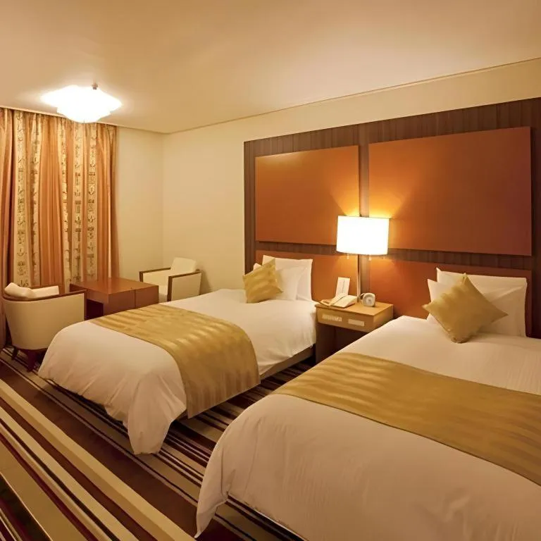 Bed in Miyazaki Kanko Hotel