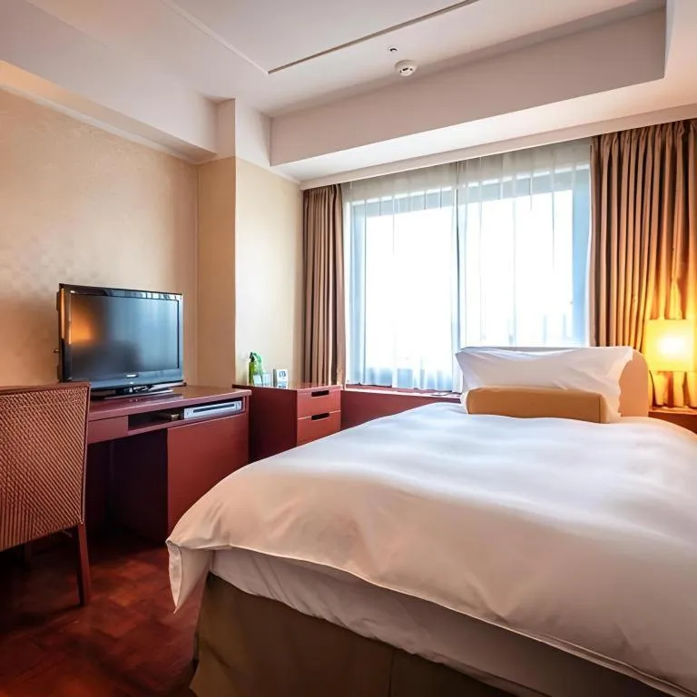 Bed in Miyazaki Kanko Hotel