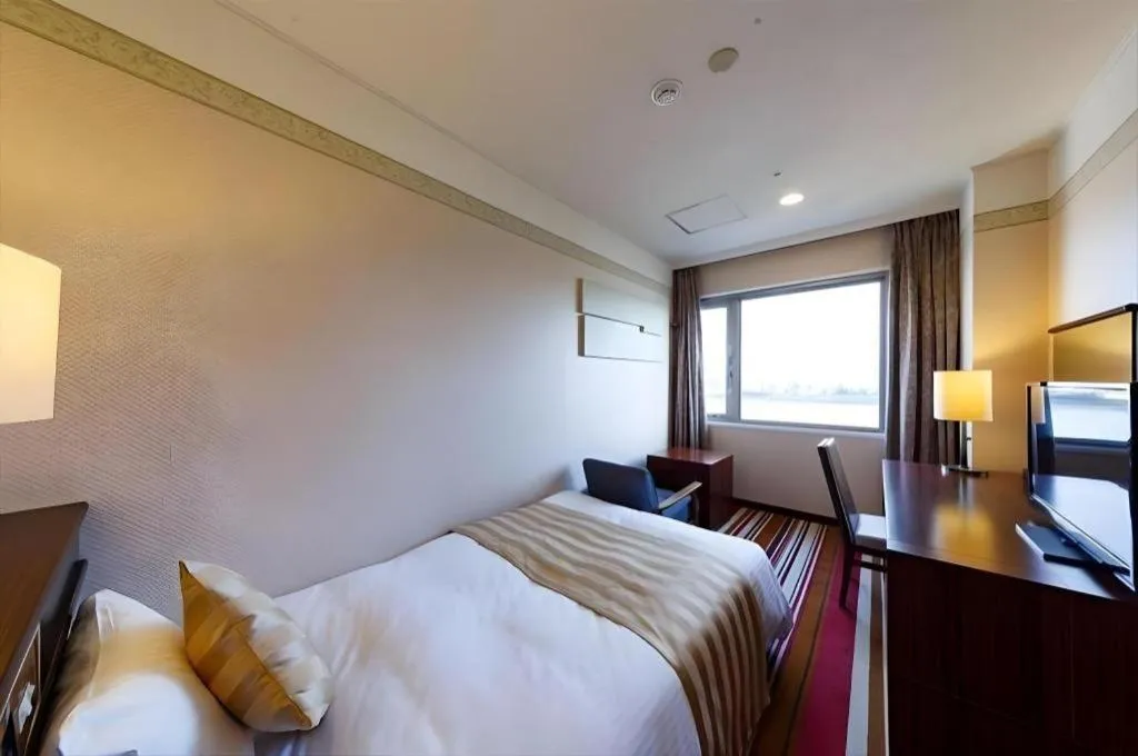 Bed in Miyazaki Kanko Hotel