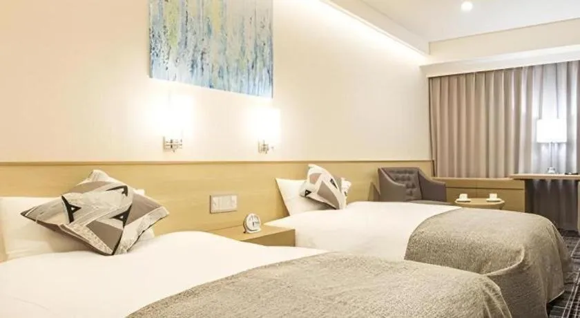 Bed in Miyazaki Kanko Hotel