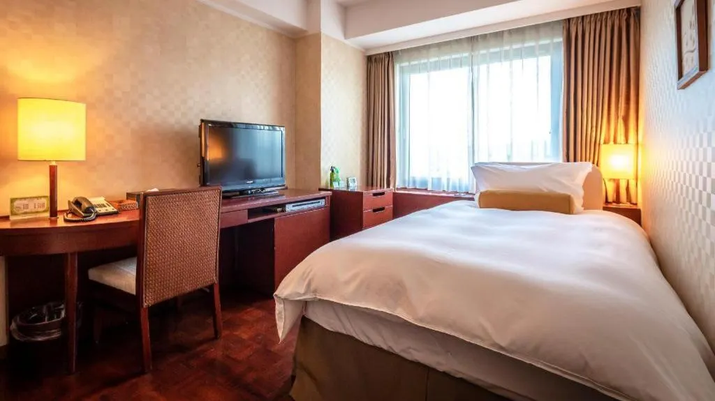 Bed in Miyazaki Kanko Hotel