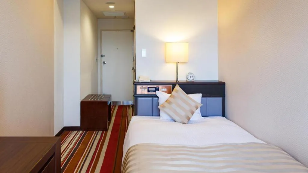 Bed in Miyazaki Kanko Hotel