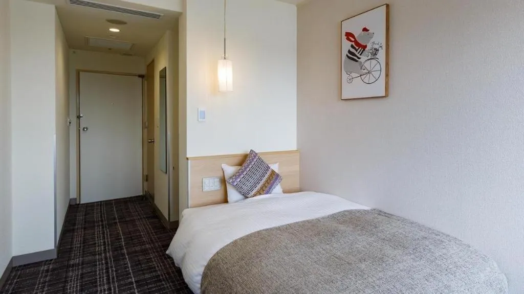 Bed in Miyazaki Kanko Hotel