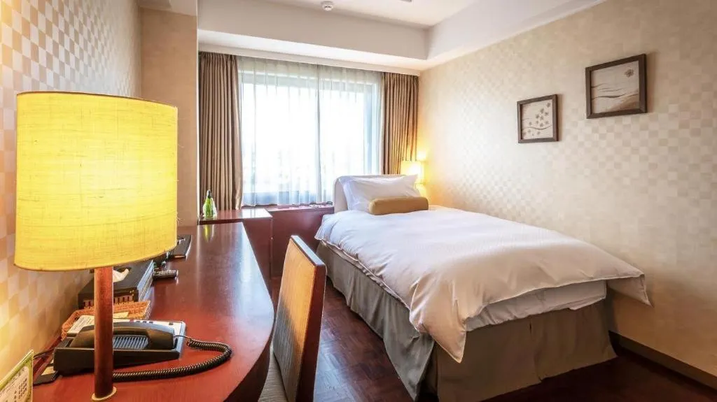 Bed in Miyazaki Kanko Hotel