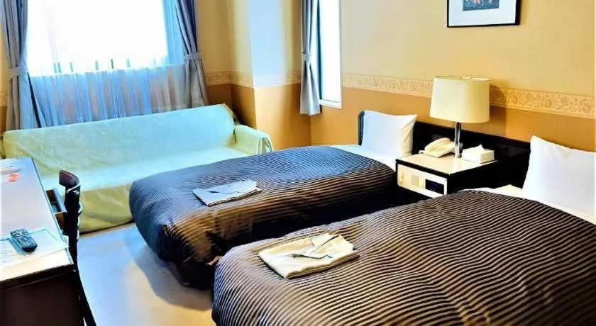 Bed in The Hamilton Sapporo Hotel