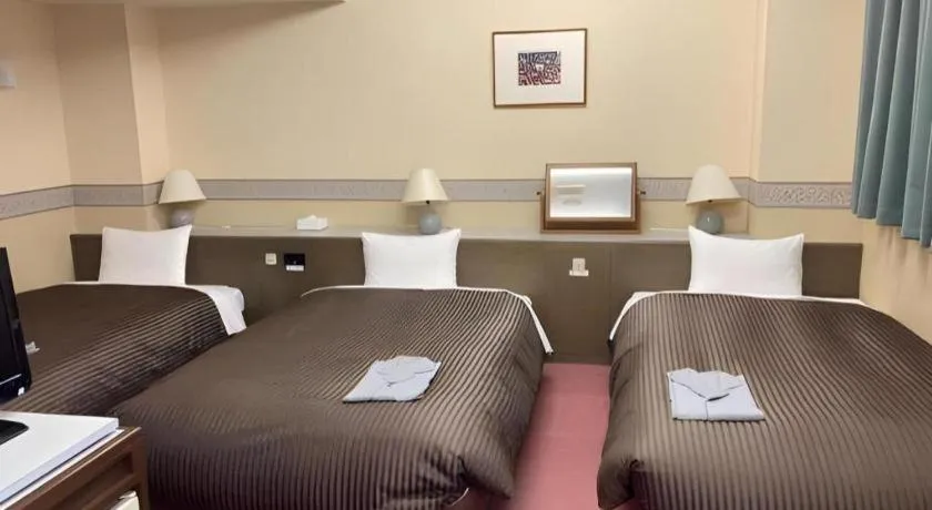 Bed in The Hamilton Sapporo Hotel