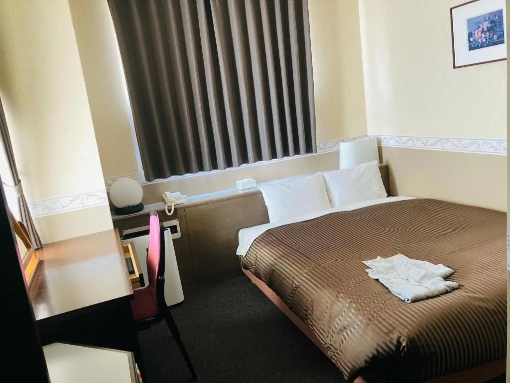 Bed in The Hamilton Sapporo Hotel