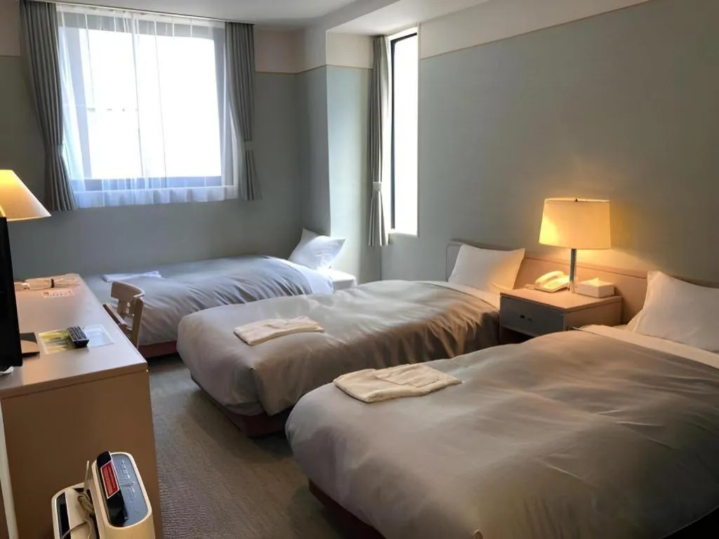 Bed in The Hamilton Sapporo Hotel