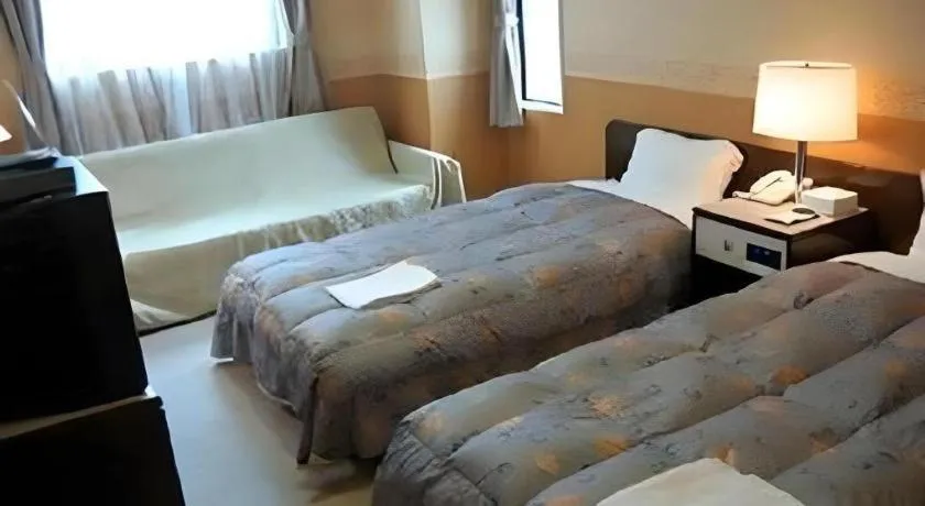 Bed in The Hamilton Sapporo Hotel