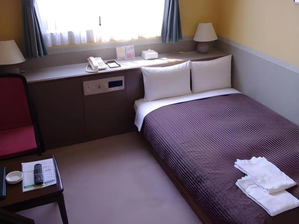 Bed in The Hamilton Sapporo Hotel