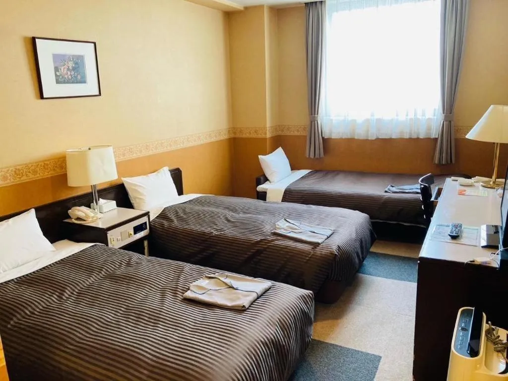 Bed in The Hamilton Sapporo Hotel