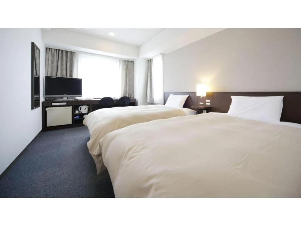 Bed in Hotel Park Side Hiroshima Peace Park