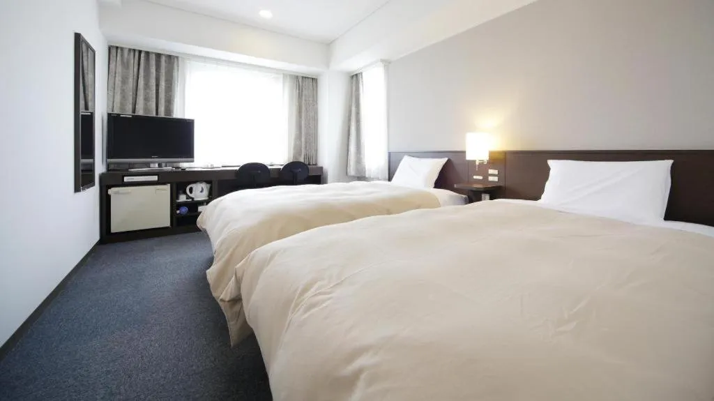 Bed in Hotel Park Side Hiroshima Peace Park