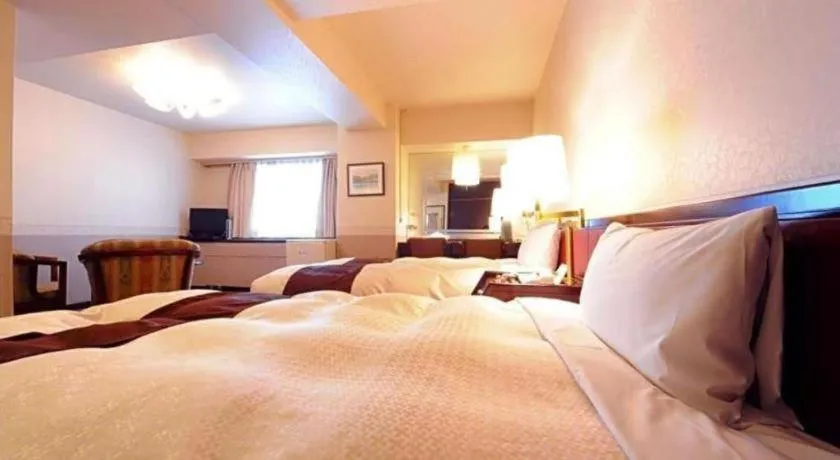 Bed in Hiroshima Kokusai Hotel