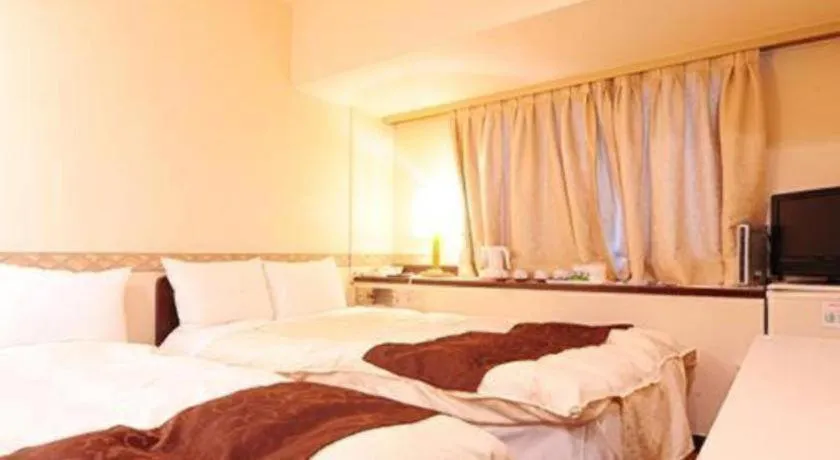 Bed in Hiroshima Kokusai Hotel