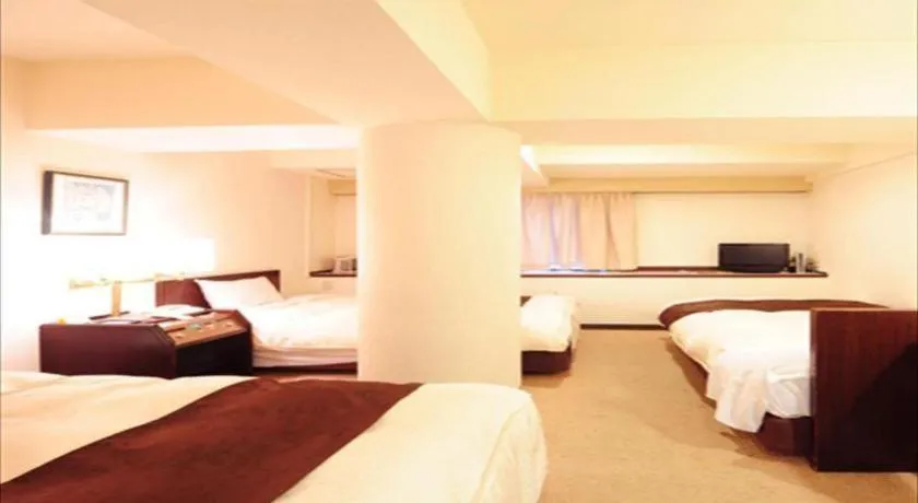 Bed in Hiroshima Kokusai Hotel