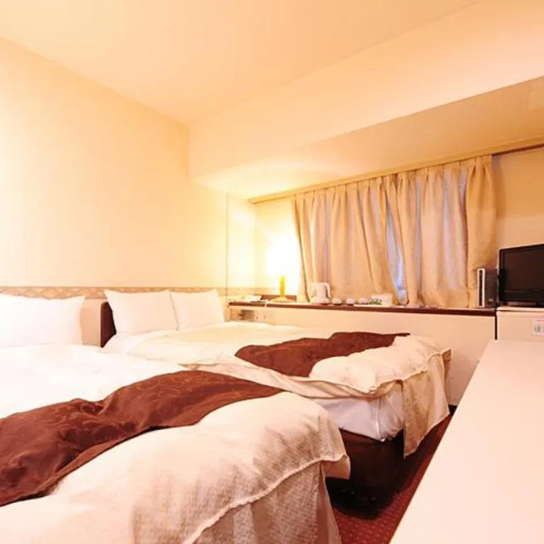 Bed in Hiroshima Kokusai Hotel