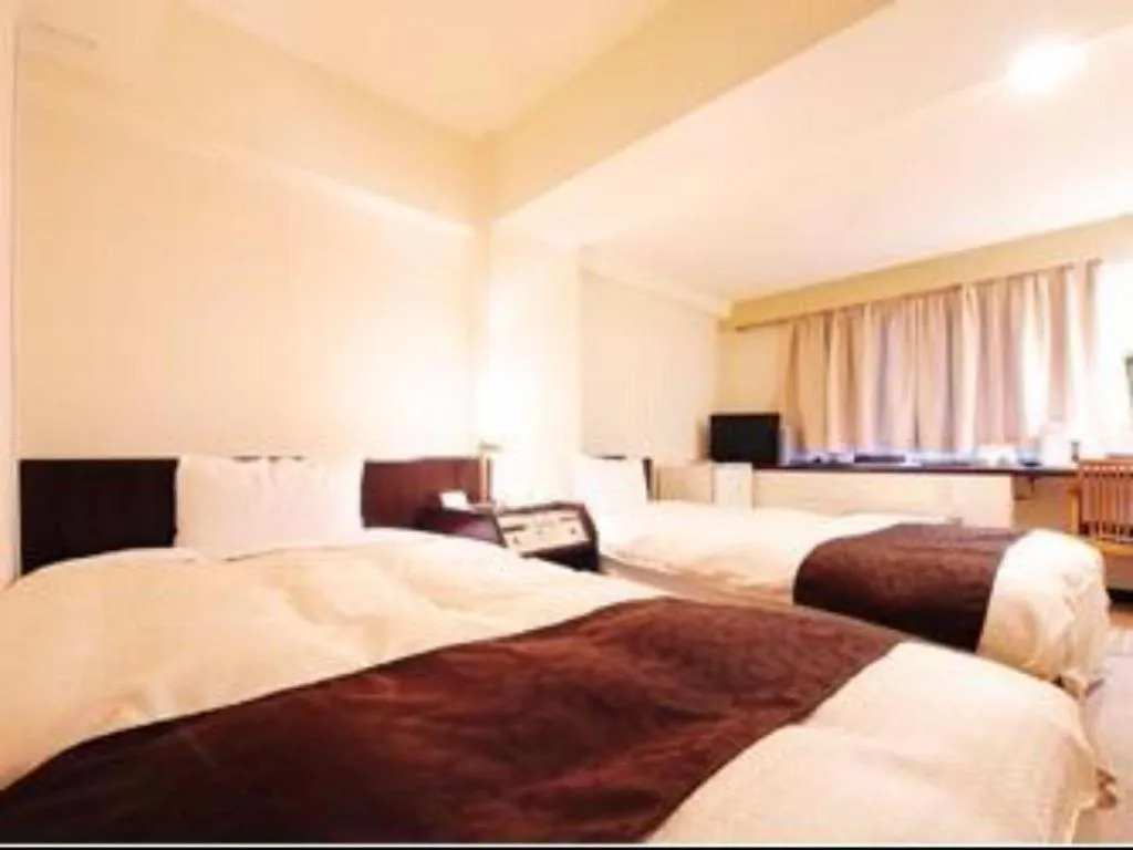 Bed in Hiroshima Kokusai Hotel