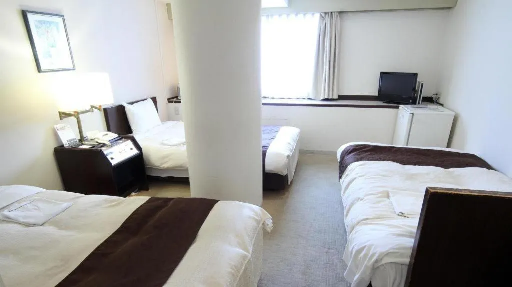 Bed in Hiroshima Kokusai Hotel