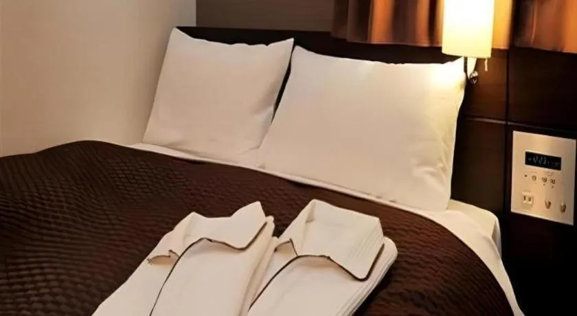 Bed in Daini Fuji Hotel