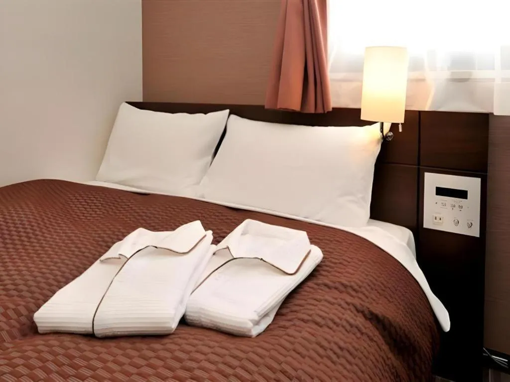 Bed in Daini Fuji Hotel