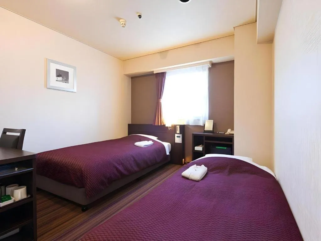 Bed in Daini Fuji Hotel