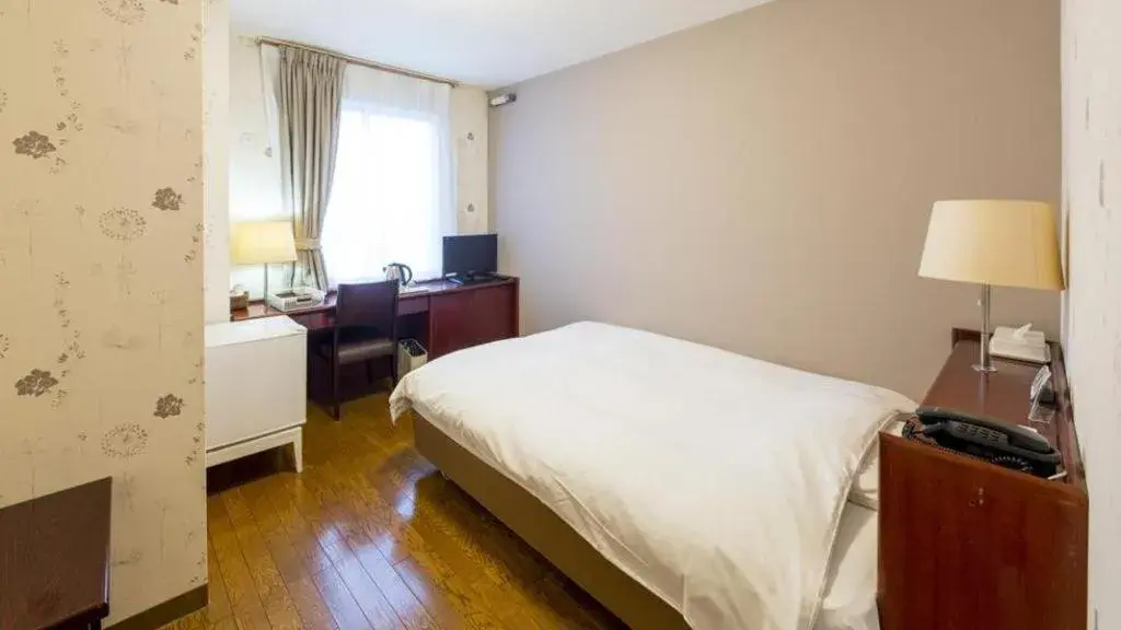 Bed in Fukuyama Terminal Hotel Bed in Fukuyama Terminal Hotel