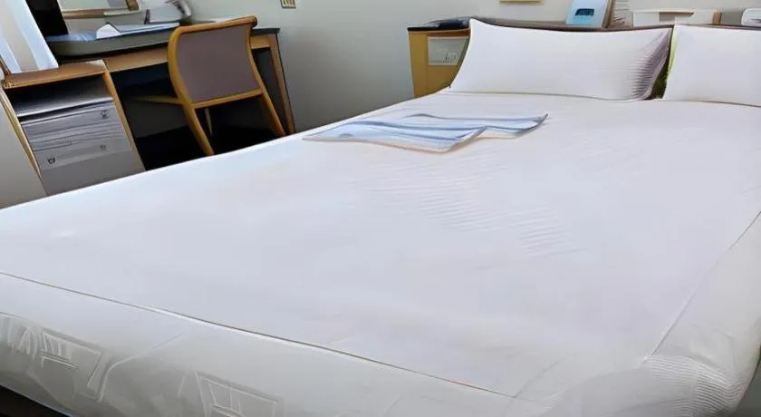 Bed in Pearl Hotel Kawasaki