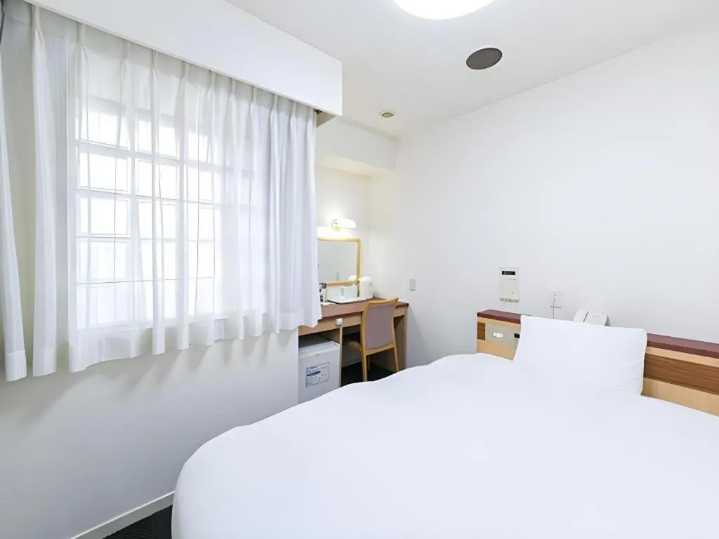 Bed in Pearl Hotel Kawasaki