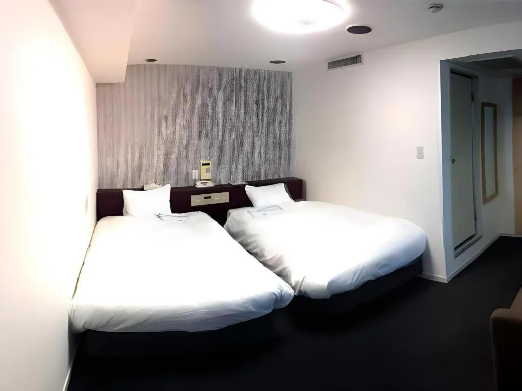 Bed in Pearl Hotel Kawasaki