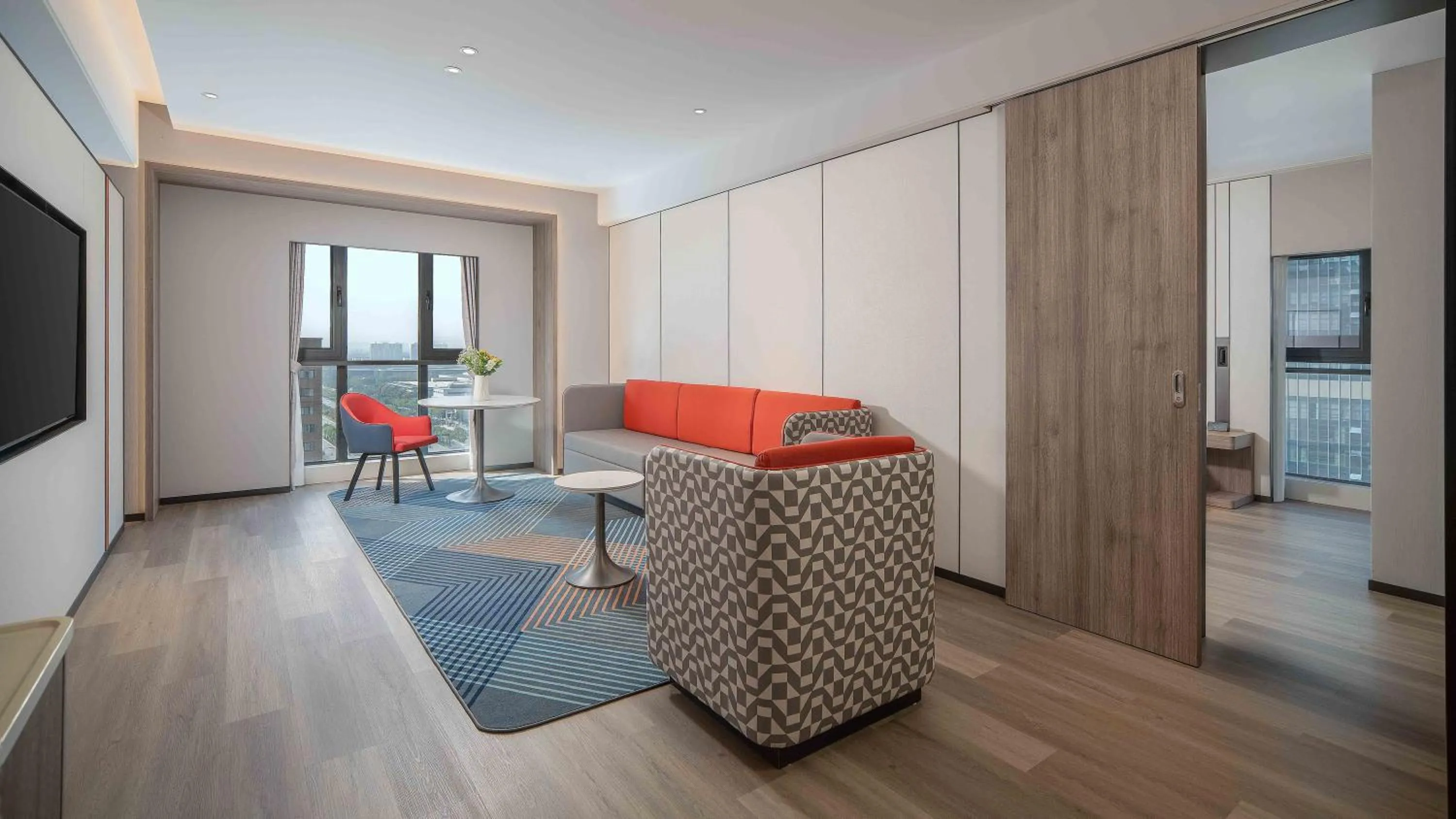 Living room in Holiday Inn Express Xi'an Fengdong by IHG