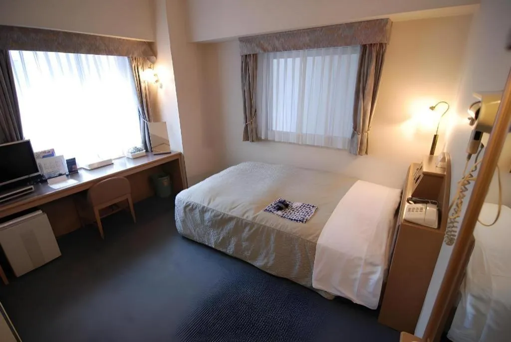 Bed in Hotel Starplaza Ikebukuro