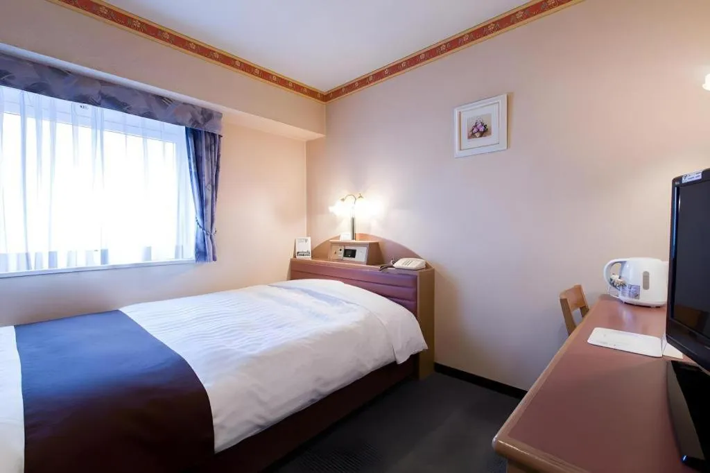 Bed in Hotel Starplaza Ikebukuro