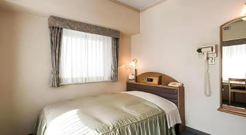 Bed in Hotel Starplaza Ikebukuro