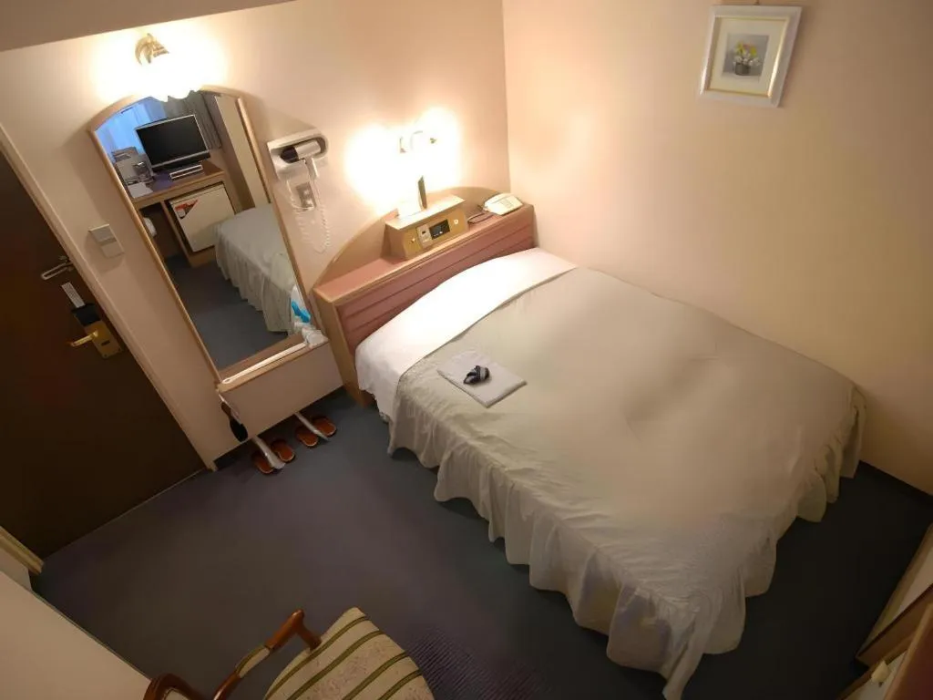 Bed in Hotel Starplaza Ikebukuro