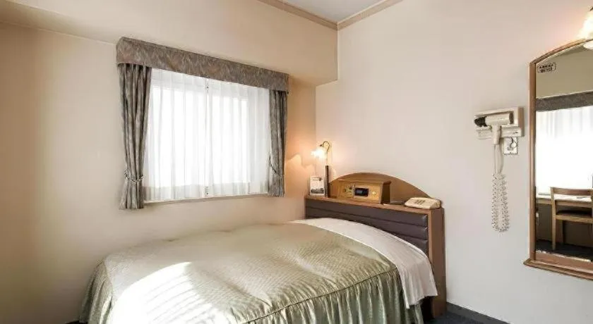 Bed in Hotel Starplaza Ikebukuro