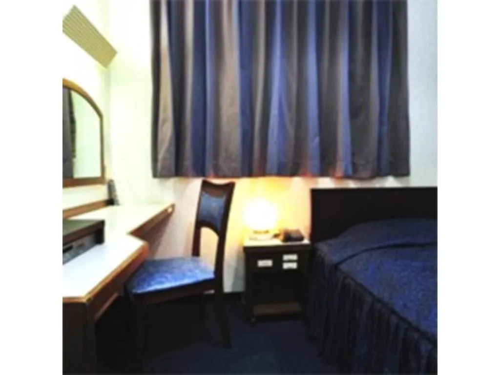 Bed in Tokyo Business Hotel