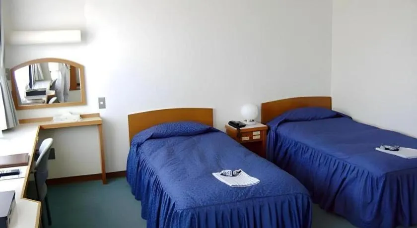 Bed in Tokyo Business Hotel