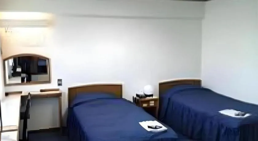 Bed in Tokyo Business Hotel