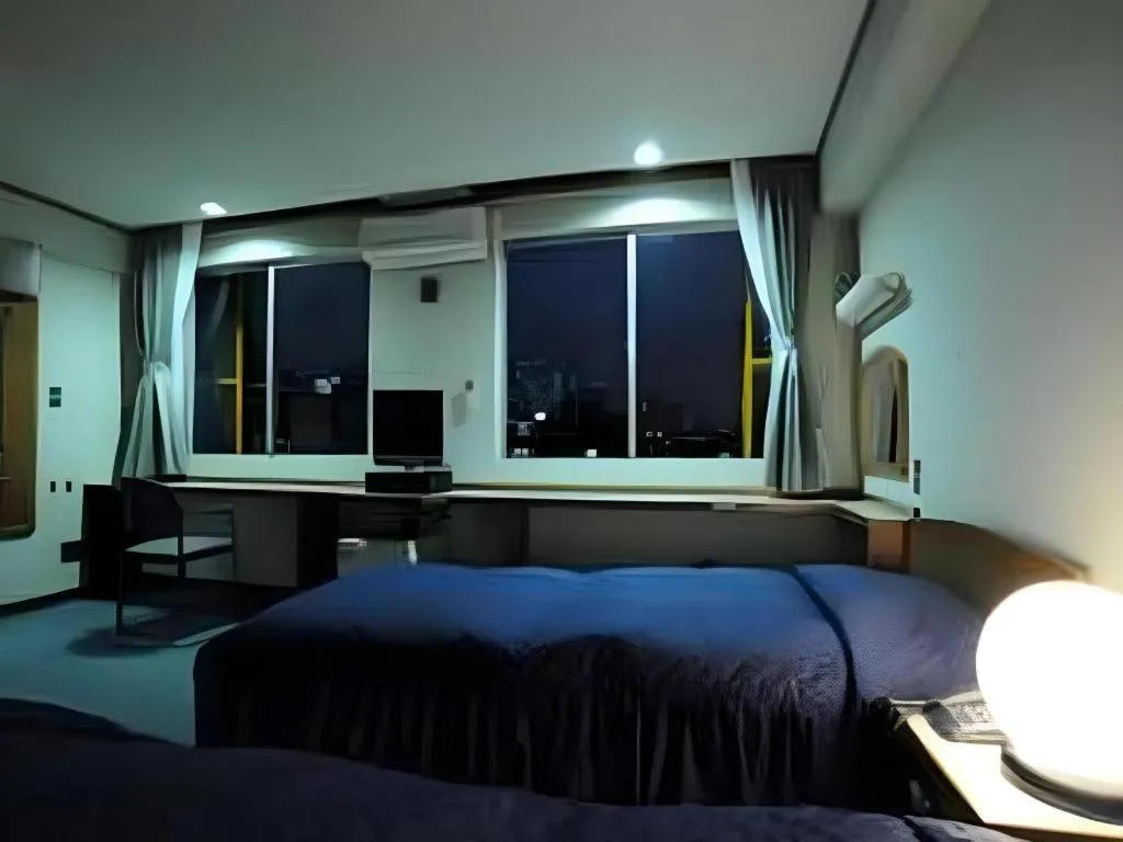 Bed in Tokyo Business Hotel